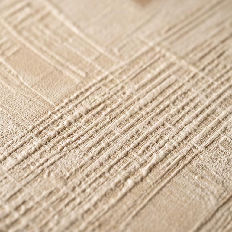 織物の質感を再現したベージュ色の壁紙の接写